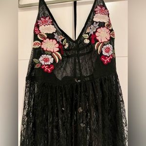 Lace dress. Embroidered flowers on the top